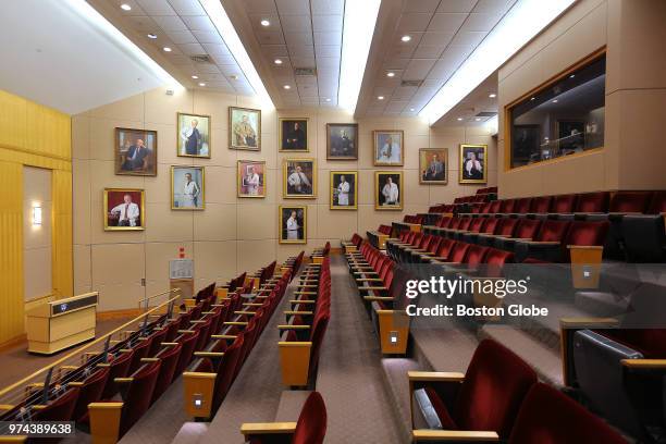 Portraits hang on the wall inside the Louis Bornstein Family Amphitheater at Brigham and Women's Hospital in Boston on June 12, 2018. The portraits...