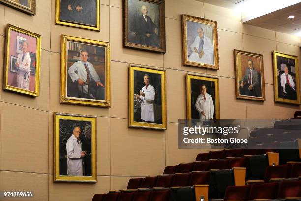 Portraits hang on the wall inside the Louis Bornstein Family Amphitheater at Brigham and Women's Hospital in Boston on June 12, 2018. The portraits...