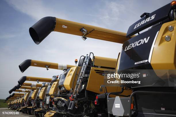 Combine harvesters sit parked before shipment at the CLAAS of America Inc. Production facility in Omaha, Nebraska, U.S., on Wednesday, June 6, 2018....