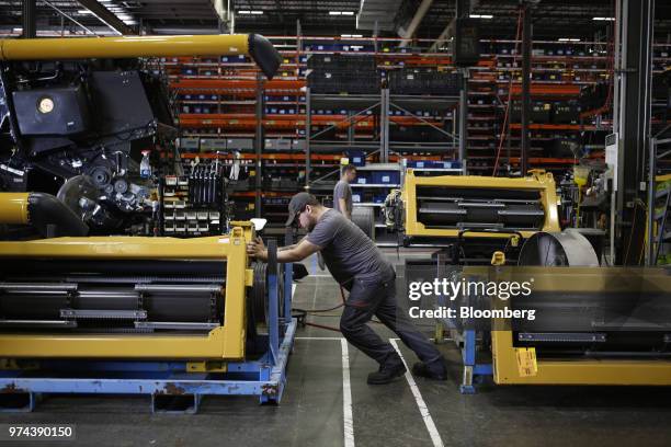 Worker assembles a combine harvester at the CLAAS of America Inc. Production facility in Omaha, Nebraska, U.S., on Wednesday, June 6, 2018. The...