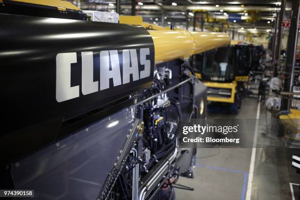 Signage is displayed on a combine harvester at the CLAAS of America Inc. Production facility in Omaha, Nebraska, U.S., on Wednesday, June 6, 2018....