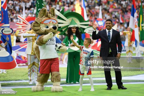 Former Brazilian player Ronaldo cheers the fans with mascot Zabivaka the Wolf prior tothe 2018 FIFA World Cup Russia Group A match between Russia and...