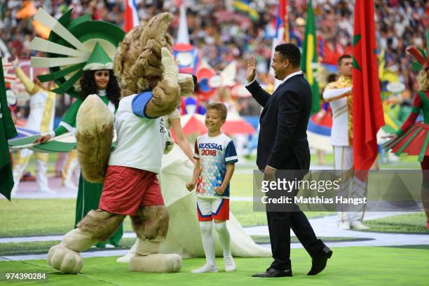 Former Brazilian player Ronaldo cheers the fans with mascot Zabivaka the Wolf prior tothe 2018 FIFA World Cup Russia Group A match between Russia and...