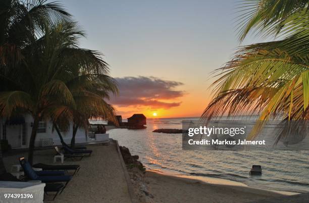 sunset, half moon jamaica - half moon position stock pictures, royalty-free photos & images