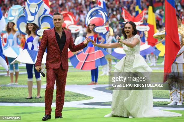 English musician Robbie Williams and Russian soprano Aida Garifullina perform during the Russia World Cup opening ceremony before the tournament's...