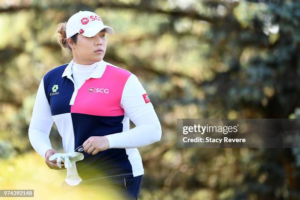 Ariya Jutanugarn of Thailand walks to the third tee during the first round of the Meijer LPGA Classic for Simply Give at Blythefield Country Club on...