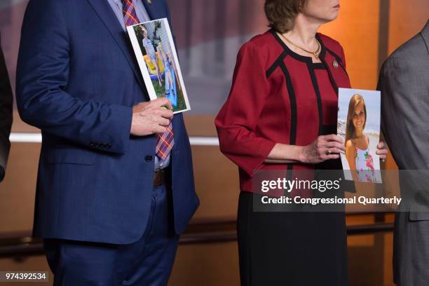 June 13: House Republican leaders hold photos of people from their district effected by the opioid epidemic during a press conference about in the...