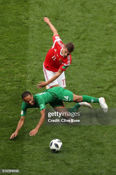 Abdullah Otayf of Saudi Arabia is fouled by Roman Zobnin of Russia during the 2018 FIFA World Cup Russia Group A match between Russia and Saudi...
