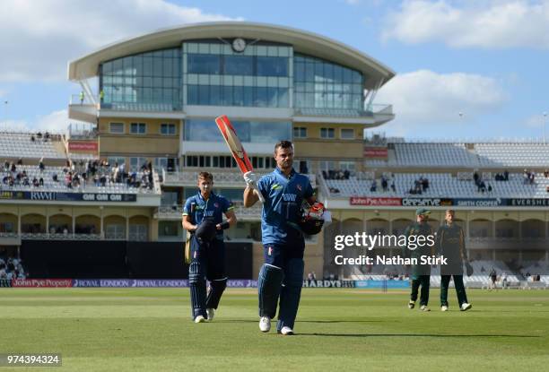 Heino Kuhn of Kent raises his bat after scoring 124 not out during the Royal London One-Day Cup match between Nottinghamshire Outlaws and Kent...