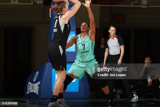 Carolyn Swords of the Las Vegas Aces handles the ball against Kia Vaughn of the New York Liberty during the game on June 13, 2018 at Westchester...