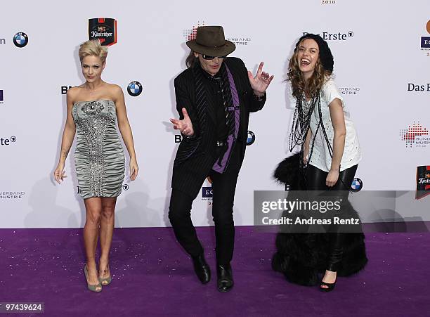 Singers Michelle, Udo Lindenberg and Saint Lou dance upon their arrival at Echo award 2010 at Messe Berlin on March 4, 2010 in Berlin, Germany.