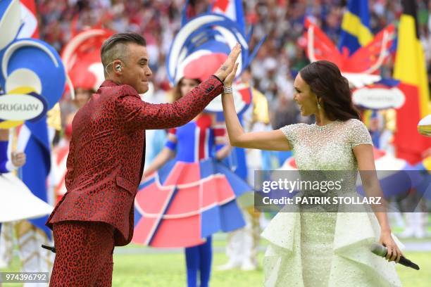 English musician Robbie Williams and Russian soprano Aida Garifullina perform during the Russia World Cup opening ceremony before the tournament's...