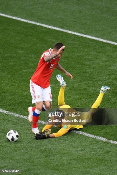 Abdullah Almuaiouf of Saudi Arabia makes a save on Fedor Smolov of Russia during the 2018 FIFA World Cup Russia Group A match between Russia and...