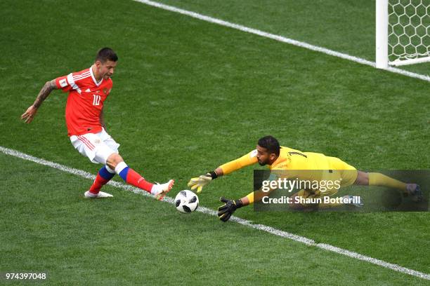 Abdullah Almuaiouf of Saudi Arabia makes a save on Fedor Smolov of Russia during the 2018 FIFA World Cup Russia Group A match between Russia and...