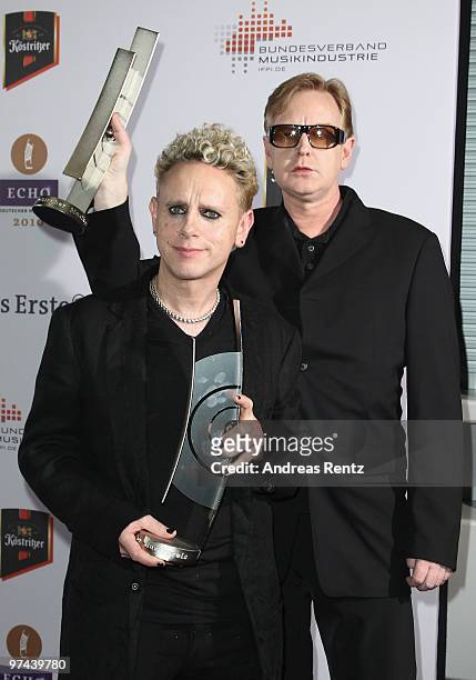 Martin Gore and Andrew Fletcher of the band Depeche Mode pose with the Echo award 2010 at the Messe Berlin on March 4, 2010 in Berlin, Germany.