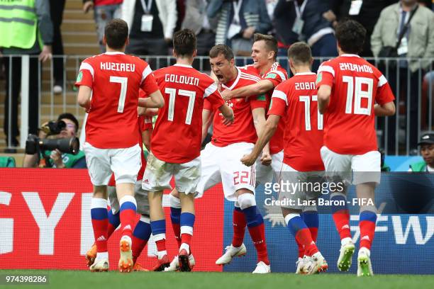 Artem Dzyuba of Russia celebrates with teammates after scoring his team's third goal during the 2018 FIFA World Cup Russia Group A match between...