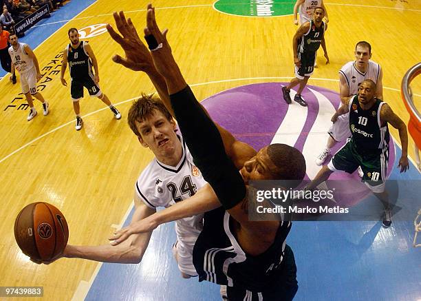 Jan Vesely, #24 of Partizan Belgrade competes with Mike Batiste, #8 of Panathinaikos Athens during the Euroleague Basketball 2009-2010 Last 16 Game 5...