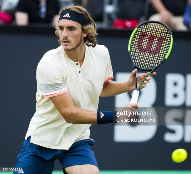 Greece's Stefanos Tsitsipas returns the ball to his Tunisia's Malek Jaziri during his men's singles tennis match at the Libema Open Tennis tournament...