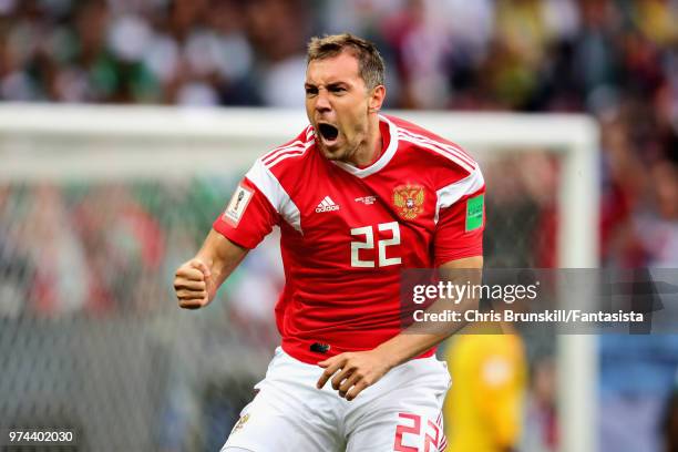 Artem Dzyuba of Russia celebrates after scoring his sides third goal during the 2018 FIFA World Cup Russia group A match between Russia and Saudi...