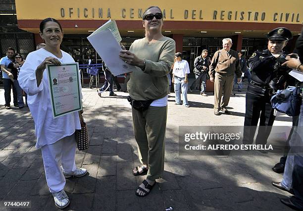 Mexican actress Jesusa Rodriguez and Musician Liliana Felipe, show their inscription papers in front of the registry office in Mexico City, on March...