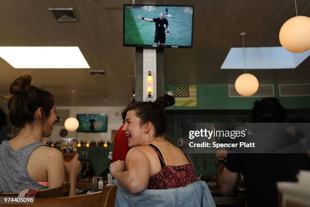 The opening soccer match of the 2018 FIFA World Cup plays at Cafe Max in Russian enclave Brighton Beach June 14, 2018 in the Brooklyn borough of New...