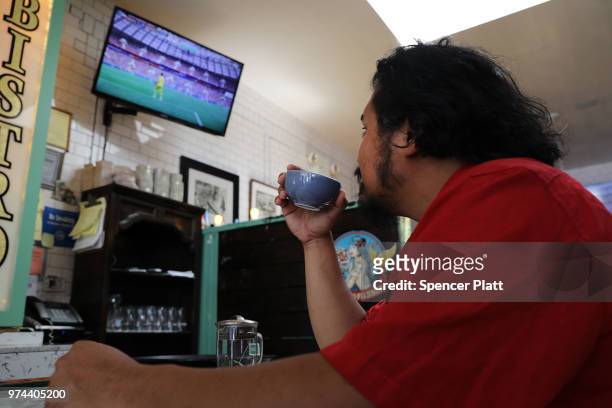 Joao Yniquez watches the opening soccer match of the 2018 FIFA World Cup at Cafe Max in Russian enclave Brighton Beach June 14, 2018 in the Brooklyn...