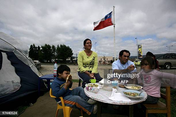 Family has luch in the streets of Concepcion, Chile, on March 4, 2010. The official death toll from Saturday's 8.8-magnitude earthquake in Chile and...