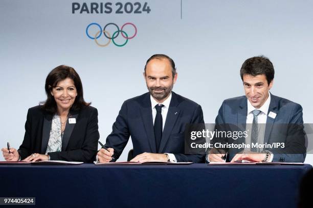 Paris Mayor Anne Hidalgo , French Prime Minister Edouard Philippe and Tony Estanguet , President of Paris 2024 attend the ceremony of signing of...