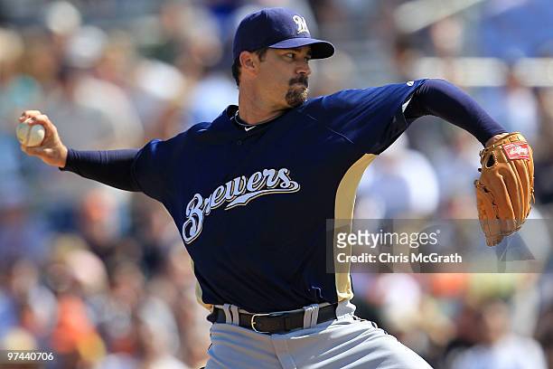 Jeff Suppan of the Milwaukee Brewers pitches against the San Francisco Giants during a spring training game at Scottsdale Stadium on March 4, 2010 in...