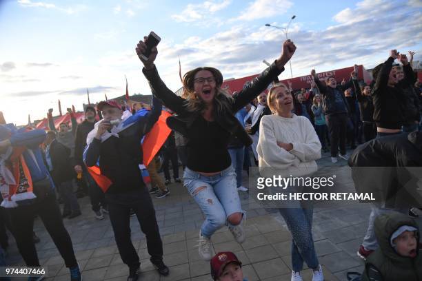 Russian fans follow the game between Russia and Saudi Arabia at the Fifa Fans Fest Ekaterinburg on June 14, 2018 during the Russia 2018 football...