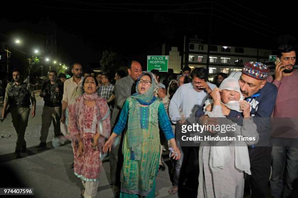 Relatives mourn the death of senior journalist Shujaat Bukhari outside Police Control Room on June 14, 2018 in Srinagar, India. Bukhari was in his...