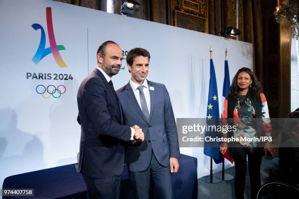 French Prime Minister Edouard Philippe and Tony Estanguet , President of Paris 2024 shake hands during the ceremony of signing of joint funding...
