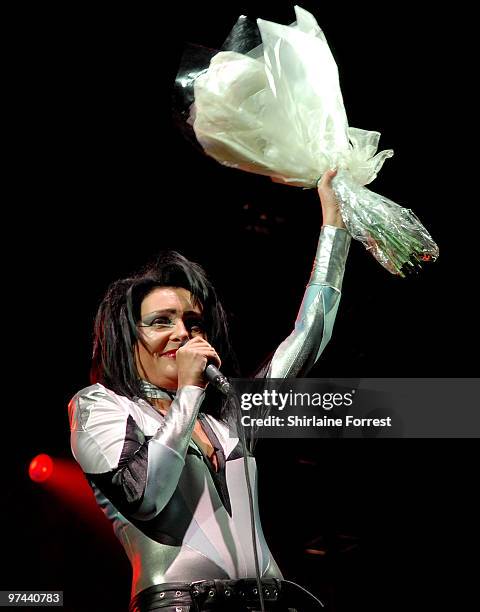 Siouxsie receives flowers from a fan while performing at day two of the V Festival at Weston Park on August 17, 2008 in Telford, England