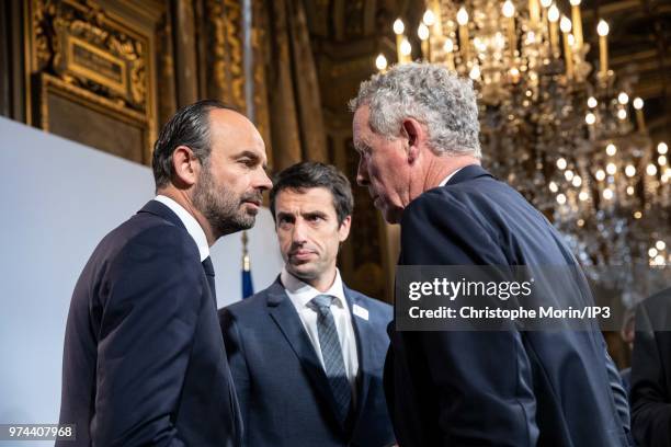 French Prime Minister Edouard Philippe , Tony Estanguet , President of Paris 2024 and IOC member Guy Drut speak during the ceremony of signing of...