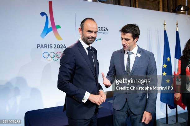 French Prime Minister Edouard Philippe and Tony Estanguet , President of Paris 2024 shake hands during the ceremony of signing of joint funding...