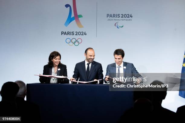 Paris Mayor Anne Hidalgo , French Prime Minister Edouard Philippe and Tony Estanguet , President of Paris 2024 attend the ceremony of signing of...