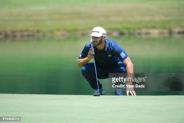 Dustin Johnson studies his putt on the third hole during the final round of the FedEx St. Jude Classic at TPC Southwind on June 10, 2018 in Memphis,...