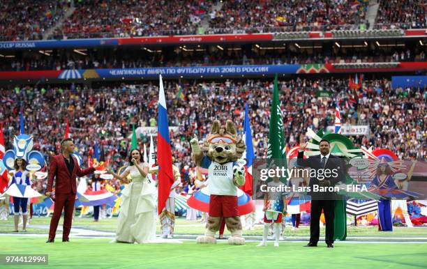 Singer Robbie Williams and Russian Soprano Aida Garifullina and Ronaldo react after their performance in the opening ceremony prior to the 2018 FIFA...