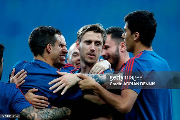 Spain's defender Nacho Monreal takes part in a training session with his teammates at the Fisht Olympic Stadium in Sochi on June 14 on the eve of the...