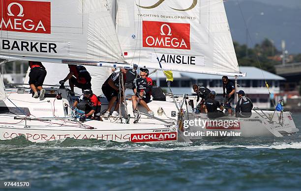 Dean Barker of New Zealand and Ben Ainslie of Great Britain skipper their boats during the Omega Auckland Yacht Racing Regatta held on the Waitemata...