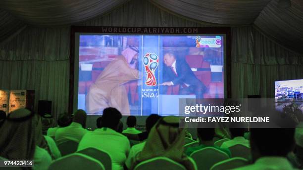 Saudi football fans watch the Russia 2018 World Cup Group A football match between Russia and Saudi Arabia at a fan tent in the capital Riyadh on...