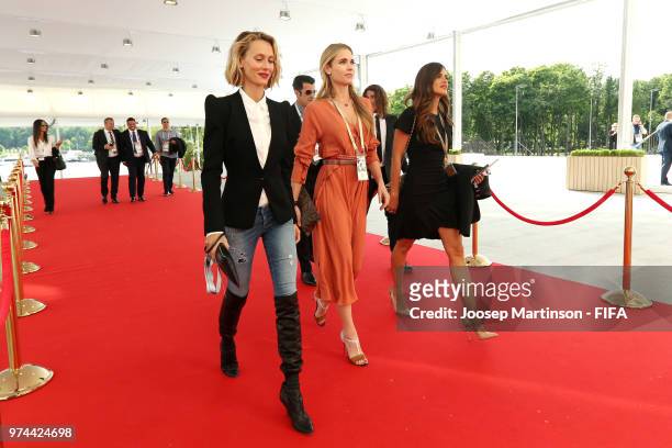 Former football players Luis Figo and Carles Puyol arrive at the stadium with their wives Vanesa Lorenzo and Daniela Svedin Figo prior to during the...