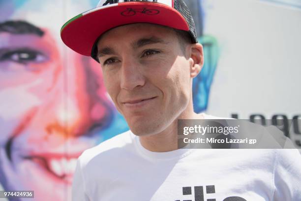 Aleix Espargaro of Spain and Aprilia Racing Team Gresini poses during the inauguration of the Luis Salom Corner graffiti installment at Turn 12 to...