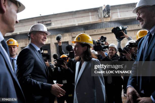 French Economy minister Bruno Lemaire shakes hands with Pays de la Loire regional council president Christelle Morancais in front of shipyard STX...