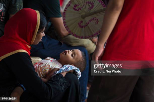 Bangladeshis cram onto a train as they travel back home to be with their families ahead of the Muslim festival of Eid al-Fitr in Dhaka , Bangladesh...