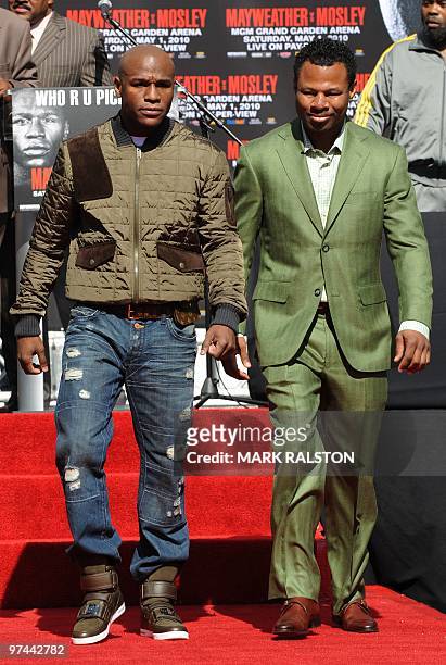 Boxers Floyd Mayweather and Shane Mosley arrive to announce their May 1 fight during their joint press conference in Los Angeles on March 4, 2010....