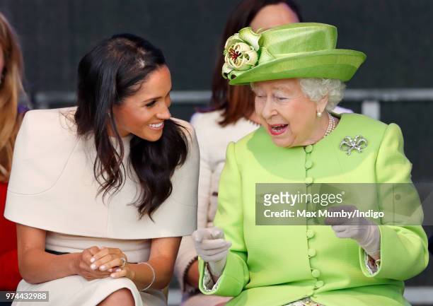 Meghan, Duchess of Sussex and Queen Elizabeth II attend a ceremony to open the new Mersey Gateway Bridge on June 14, 2018 in Widnes, England. Meghan...