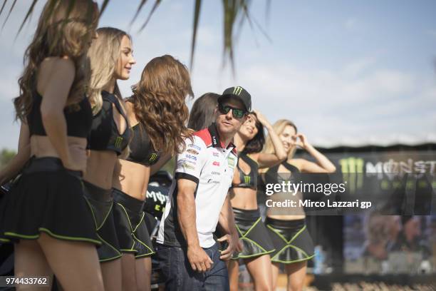 Cal Crutchlow of Great Britain and LCR Honda poses with Monster girls during the Monster Energy Station party during the MotoGp of Catalunya -...