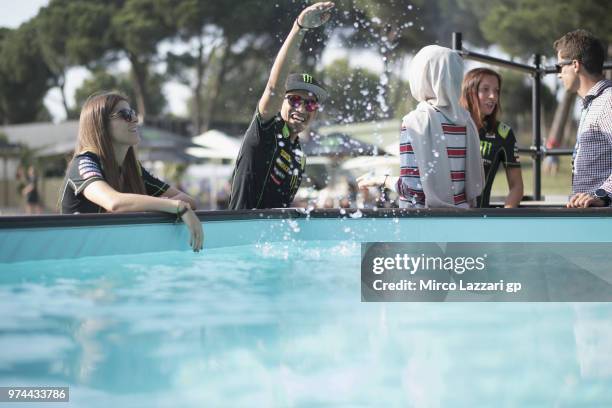 Hafizh Syahrin of Malaysia and Monster Yamaha Tech 3 jokes with water during the Monster Energy Station party during the MotoGp of Catalunya -...