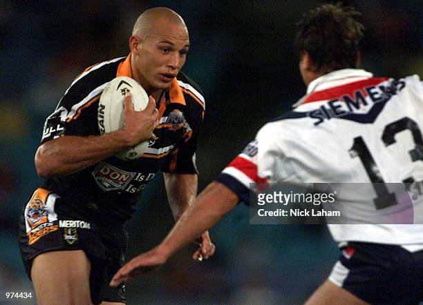 Tyran Smith of the Wests Tigers in action during the Round 1 NRL Match between the Wests Tigers and Sydney Roosters at Stadium Australia, Sydney,...